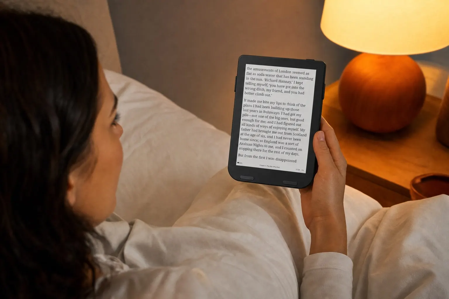 Reading a black Snug Mini in bed at night